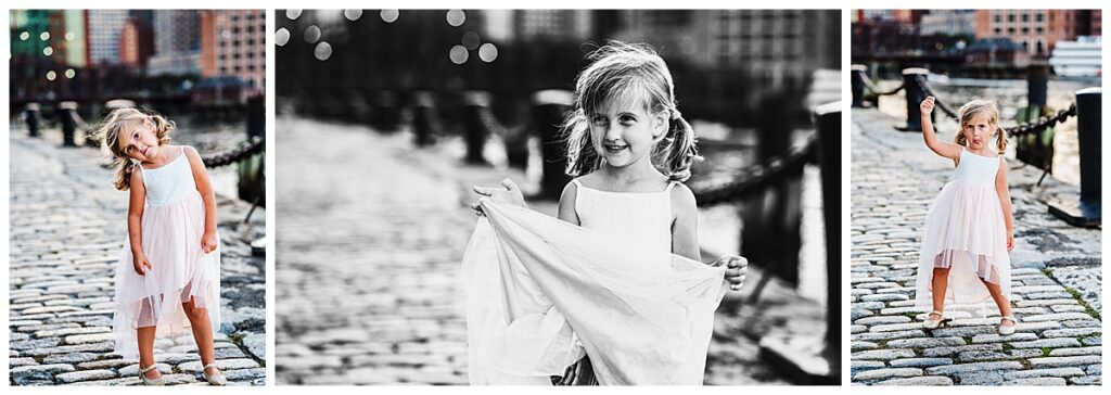 Girl in Boston wearing a dress dancing and making silly faces during family photos 