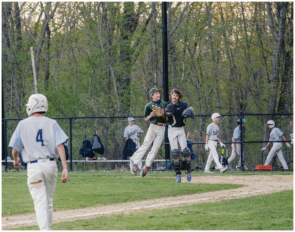 Professional sports photographer in Boston photographing athletes during baseball game