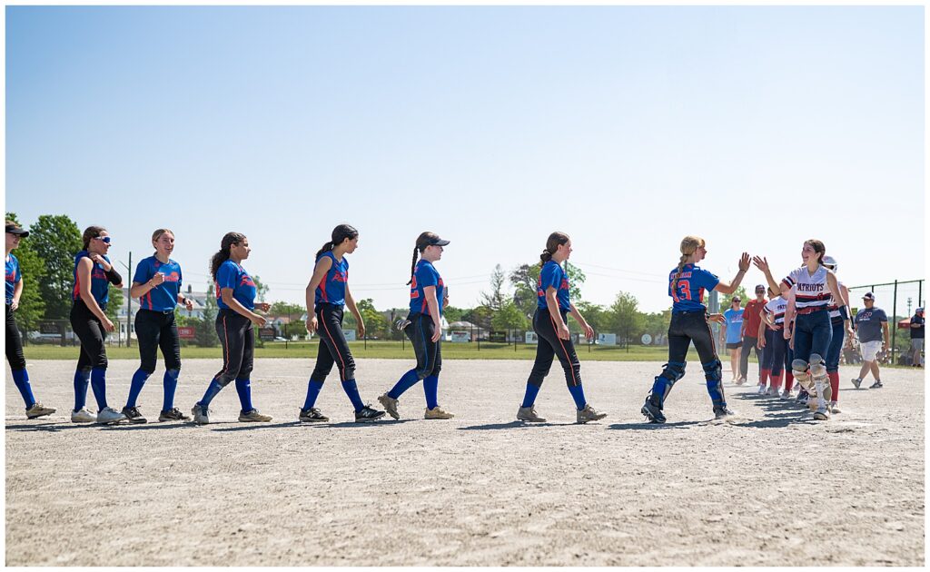 high five line during a softball game. 