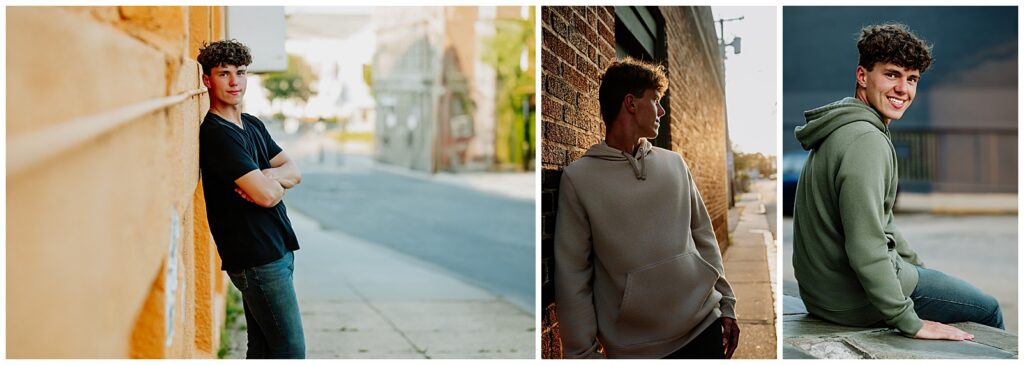 Senior boy posing against colorful urban walls in downtown Milford during a stylish outdoor senior photo session.
