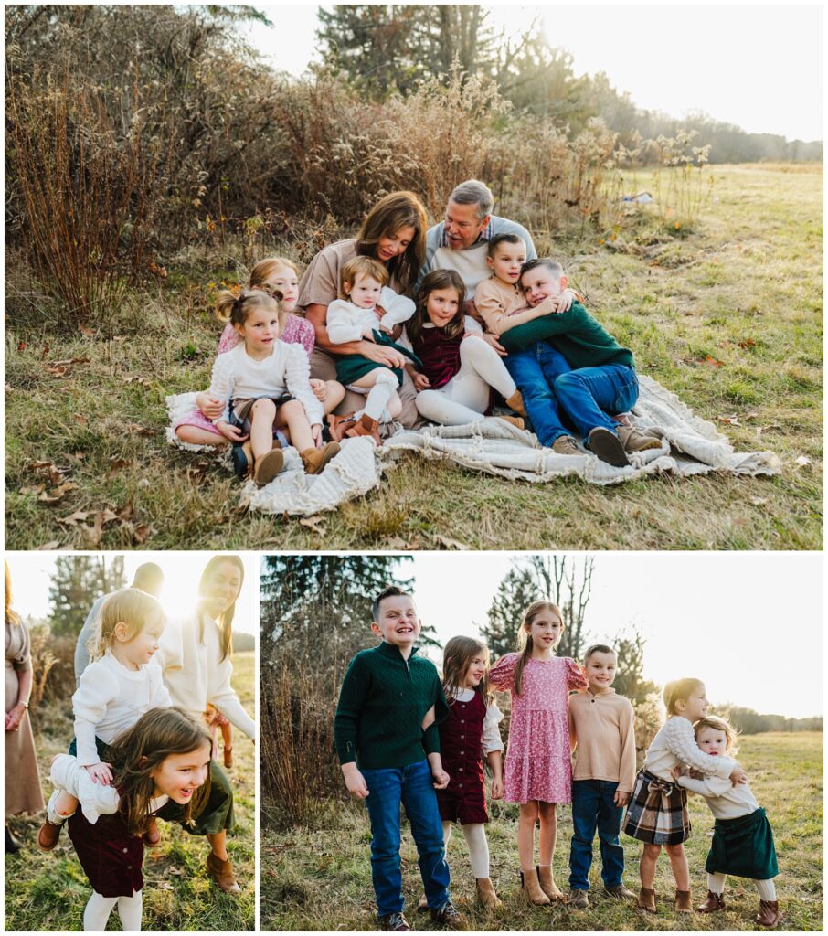 Grandparents sitting in a golden field surrounded by six grandchildren all piled together on a blanket, with cousin group portrait and sibling candid moments, extended family photographer Boston, Massachusetts