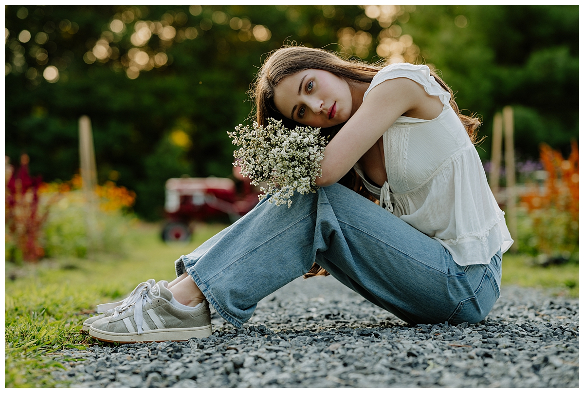 High school senior sitting during a senior session with a Boston Photographer